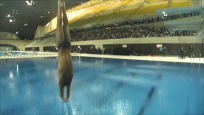 Tom Daley becomes the first person to dive into the London 2012 Aquatics Centre