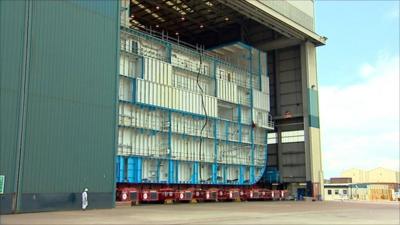 The hull of an aircraft carrier in BAE Systems shipyard