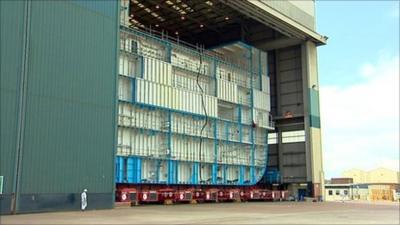 The hull of an aircraft carrier in BAE Systems shipyard