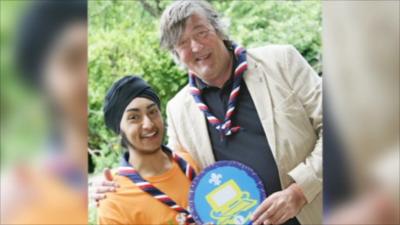 Stephen Fry receiving an honorary Scout badge for IT from Simrit Kudhail