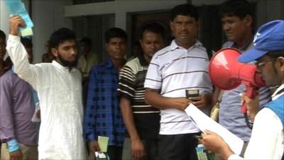 Migrant workers wait for help in Bangladesh