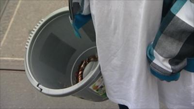 A young boy in the UK collects money to assist those affected by famine in East Africa