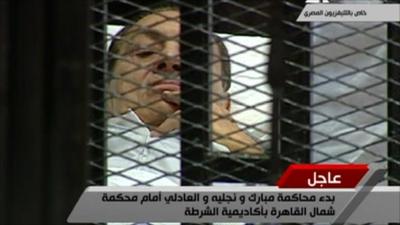 Egyptian state TV pictures of Hosni Mubarak on his stretcher in court