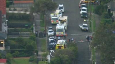 Police vehicles on the Mosman street