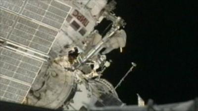 Cosmonaut outside the Russian module of the International Space Station