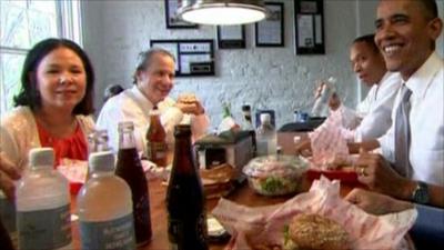 President Barack Obama and members of staff at a burger bar