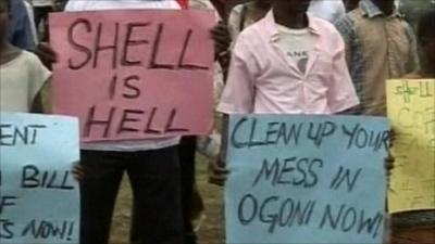 People with anti-Shell posters