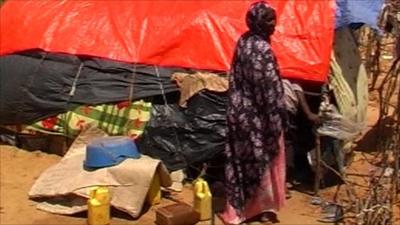 Woman at looted camp in Mogadishu