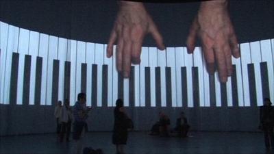 The curtain allows audience to be engulfed by images