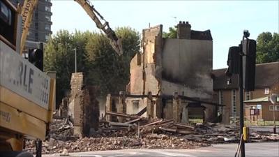 Remains of the Reeves Brothers building in Croydon, that was burnt down in Monday night's fire