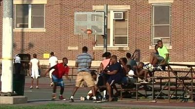 Teenagers in Philadelphia playing basketball