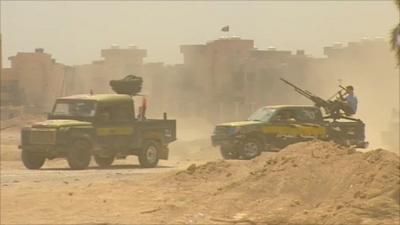 A convoy of armed rebels