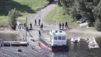 Anders Behring Breivik and police on the island of Utoeya