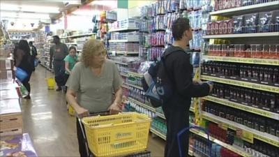 shoppers in a £1 store