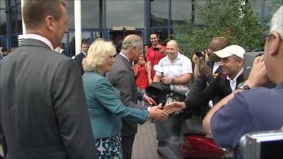 Charles and Camilla greet people outside Tottenham Green Leisure Centre