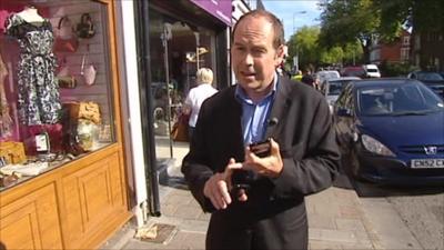 Rory Cellan-Jones holding mobile phones in Cardiff