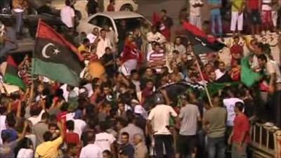 Rebels celebrate entering the Gaddafi compound