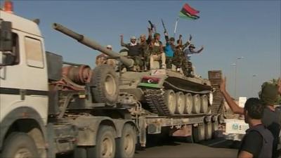 Rebels on tank pushing on towards Sirte