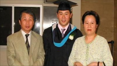 Ron Kim, centre, with parents SeoJun and Sunhee Kim