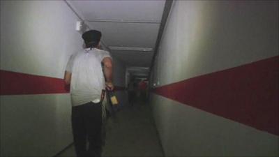 Rebel fighter in tunnel beneath Gaddafi compounds