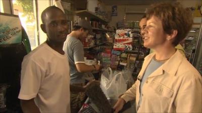 Lyse Doucet talking to a shopkeeper in Tripoli