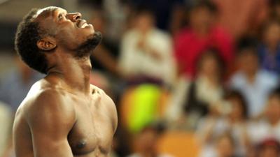 Usain Bolt reacts to his disqualification in the 100m final Daegu