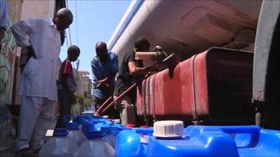 Collecting water in Tripoli