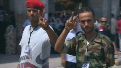 Libyans making peace sign with hands