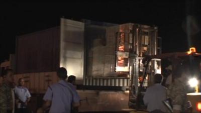 Pallets of cash be transported at Benghazi airport