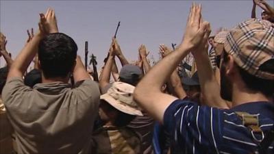 Rebel fighters applauding