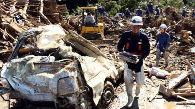 Fire crews sift through debris