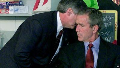 George W Bush is whispered news of the 9/11 attacks