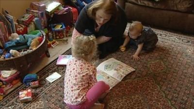 Mother playing with her two children