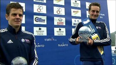 Jonny and Alistair Brownlee hold their trophies