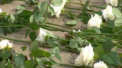 Flowers laid at memorial garden in Grosvenor Square