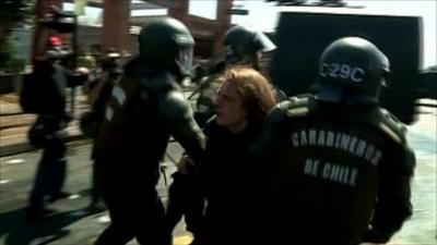 Police arrest a demonstrator in Chile