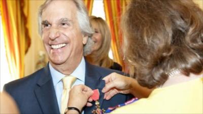 Henry Winkler with his honorary OBE