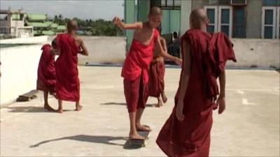 Children learning to skateboard in Burma