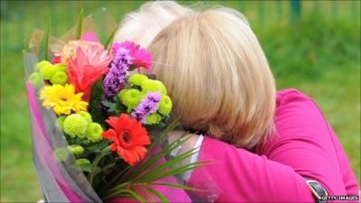 Two women hug at Pontardawe Community Centre