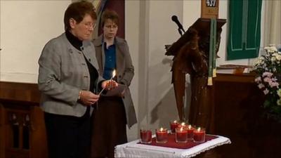 Candles lit at church service