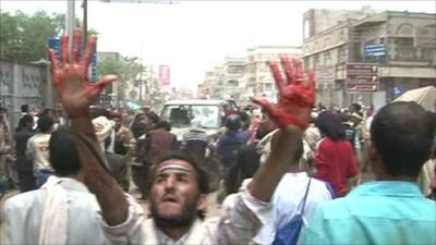 Protester holds up his hands