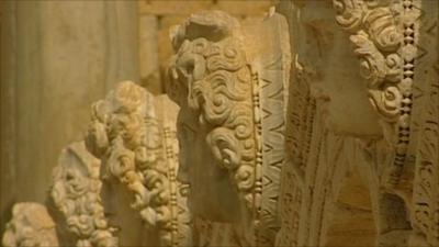 Carved stone faces