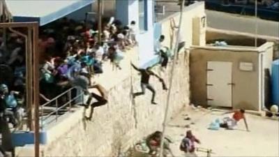 Migrants on Italian island of Lampedusa fleeing police