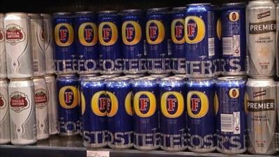 Cans of Fosters brand lager on a shelf