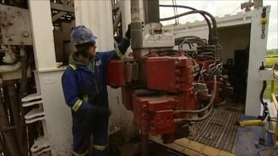 Man operating drilling machinery