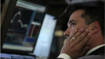 A trader on the floor of the New York Stock Exchange