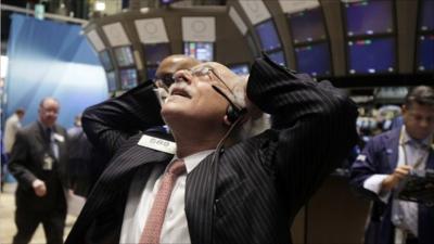 A trader on the floor of the New York Stock Exchange