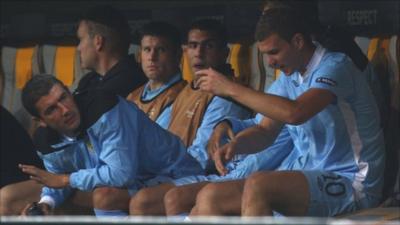 Carlos Tevez on the bench