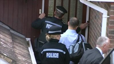 Police during a raid in Brighton