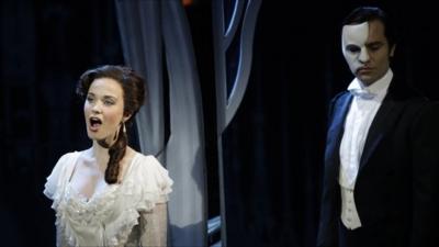 File photo, the Phantom, played by Ramin Karimloo, right, performs a scene with Christine, played by Sierra Boggess